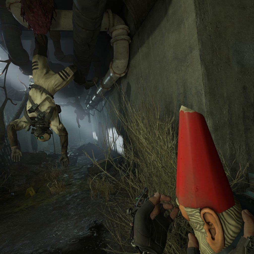 Dead soldiers hanging from ceiling. Gnome in foreground with eyes covered by player's hand.